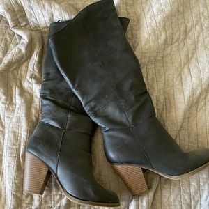 Black almost knee high pleather boots
